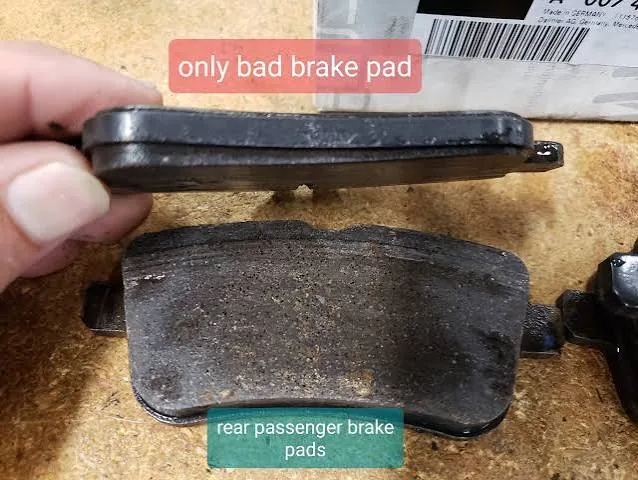 One rear passenger brake pad worn far more than the other from assist-system braking