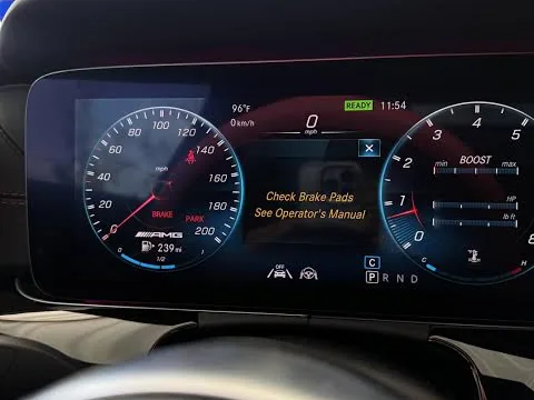 Newer Mercedes-Benz digital cockpit showing Check Brake Pads See Operator's Manual