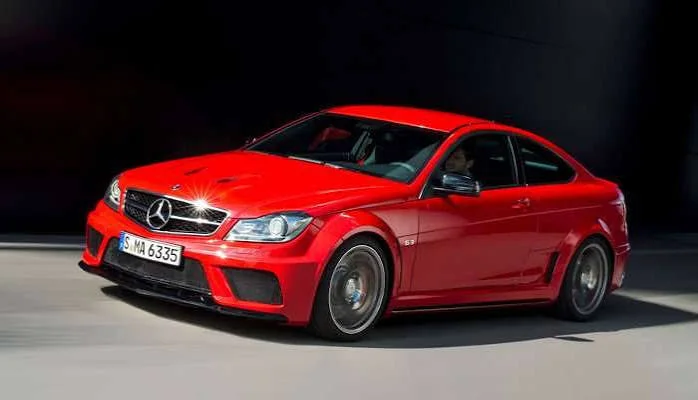 Red Mercedes-Benz C-Class coupe from the same generation