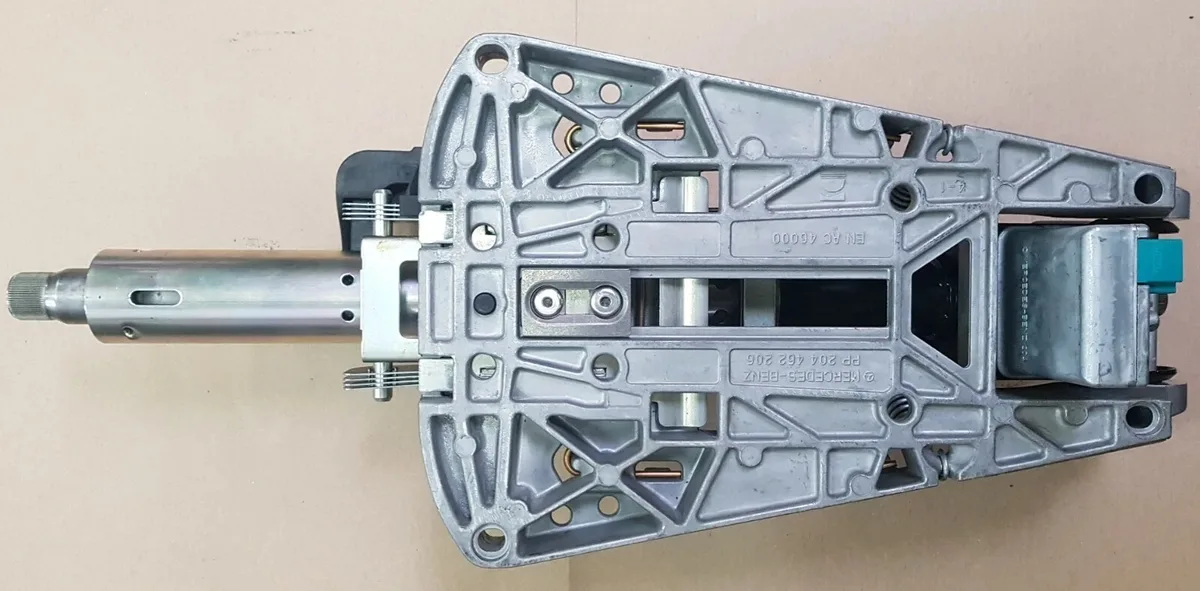 Mercedes-Benz steering column assembly seen from the top with the electronic steering lock and its green connector at the back