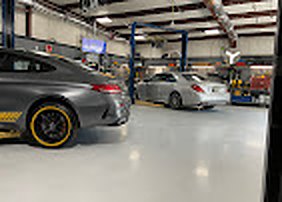 Mercedes-AMG and Mercedes-Benz sedan in the Elite Benz service bays, Summerville SC